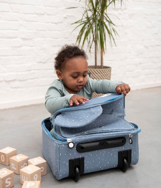 1. Child playing with Trixie Baby Mr Elephant travel trolley, showcasing spacious interior and playful design