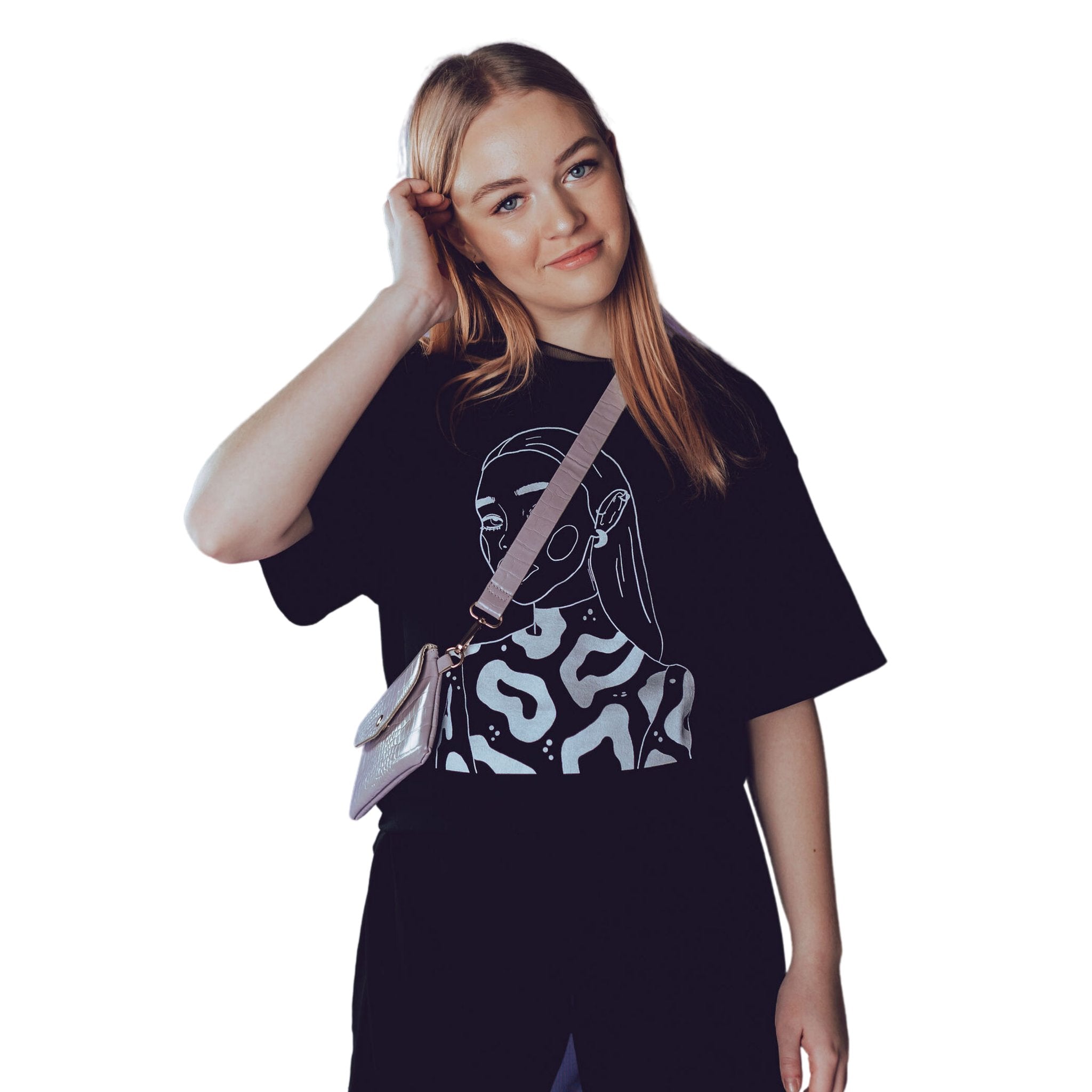 1. Woman wearing unisex organic cotton t-shirt with 'The Moon Queen' illustration by Getter Tiivits, styled with a crossbody bag
