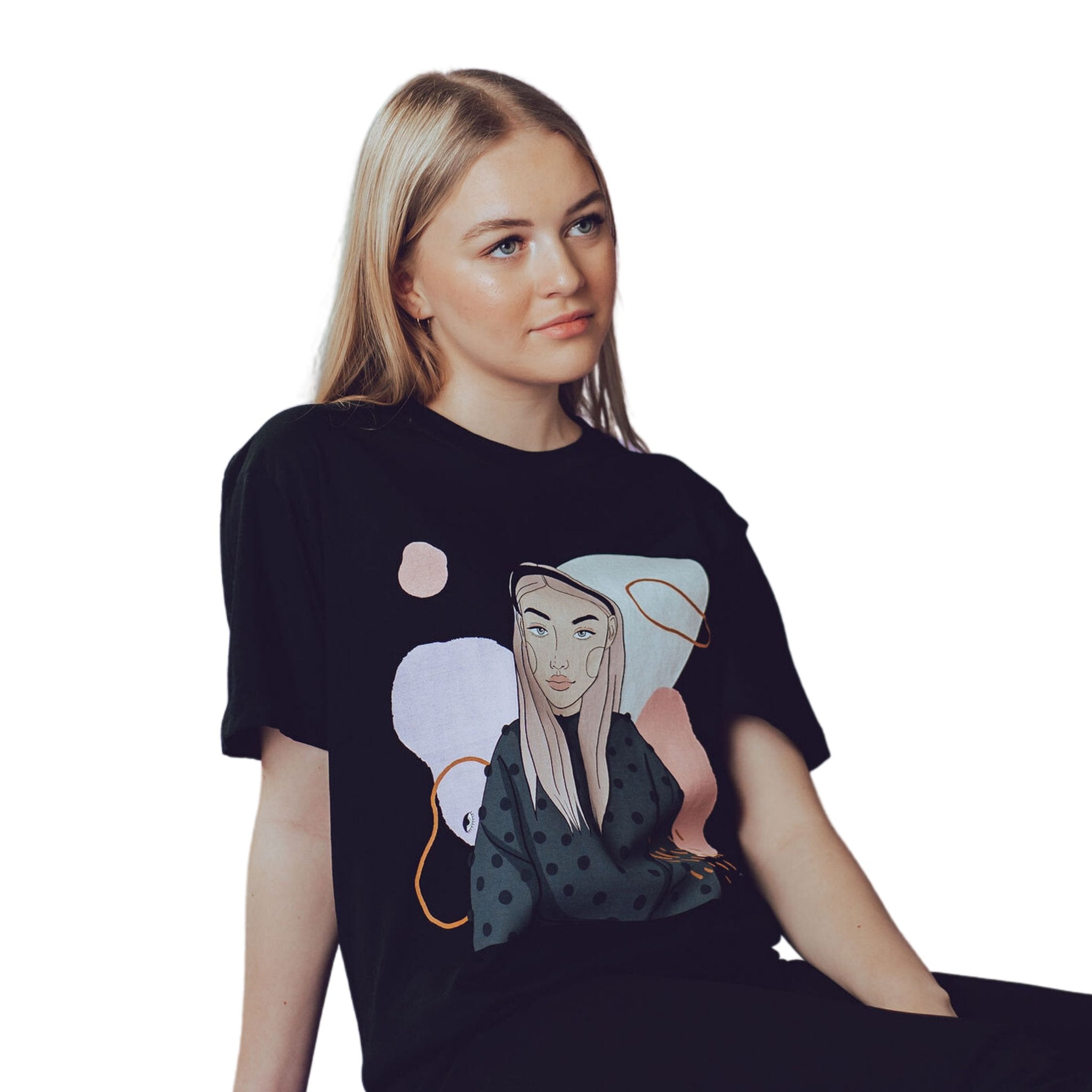 1. Woman wearing black unisex organic cotton t-shirt with illustration by Getter Tiivits, shown in lifestyle setting