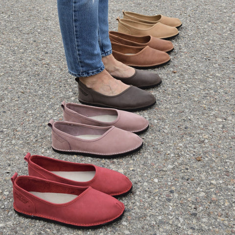 1. Women's Kuutsid Shoes in various colors, including Bordoo, displayed on pavement with model wearing jeans