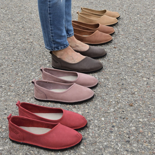1. Women's Kuutsid Shoes in various colors, including Bordoo, displayed on pavement with model wearing jeans