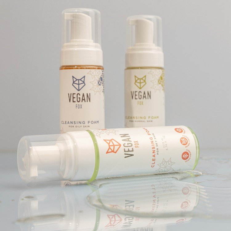 2. Vegan Fox Cleansing Foam collection for different skin types, displayed on a reflective surface