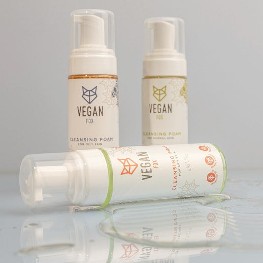 2. Vegan Fox Cleansing Foam collection for different skin types, displayed on a reflective surface