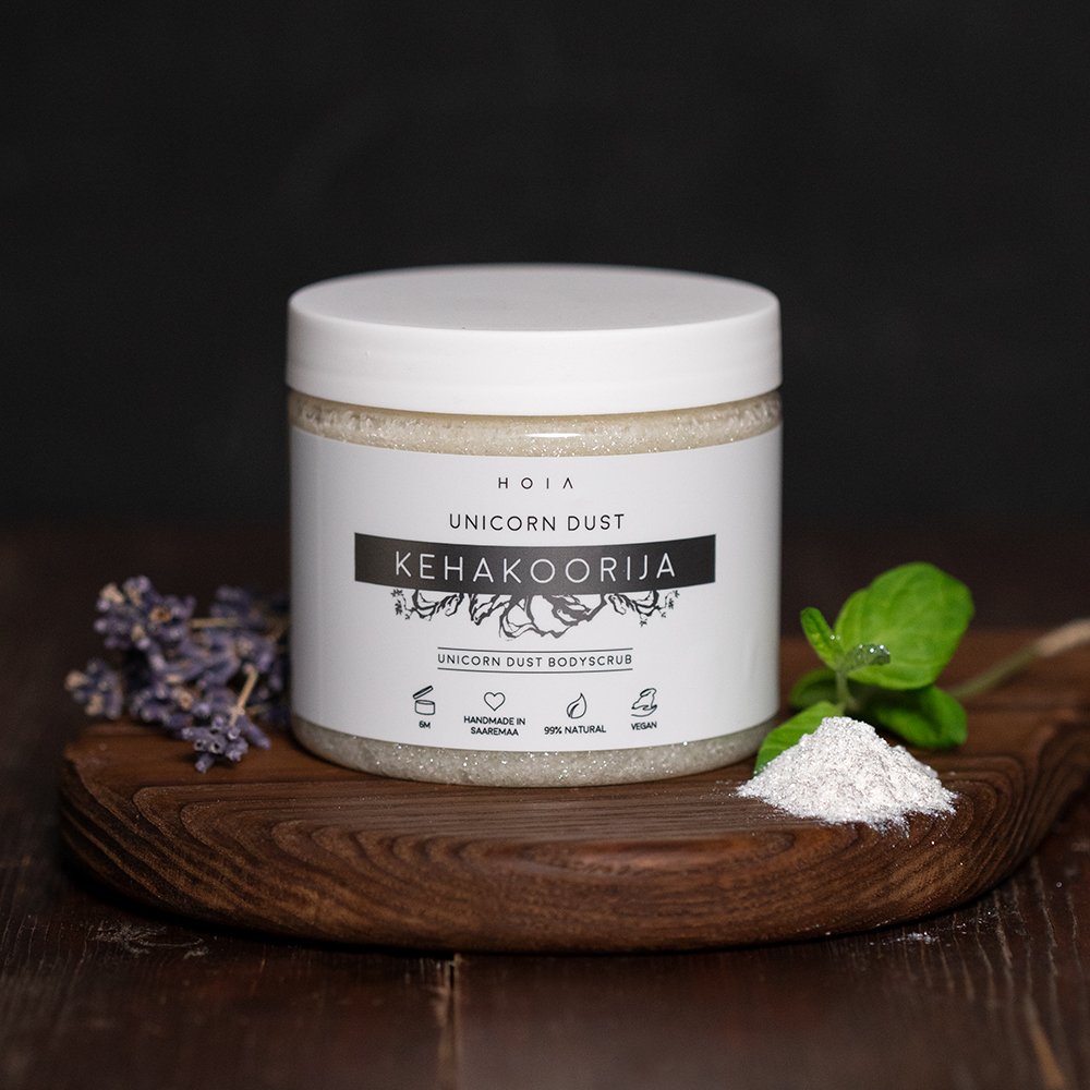 2. HOIA homespa Unicorn Dust body scrub jar on wooden surface with lavender and mint leaves