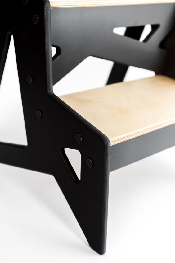 3. Close-up of black and natural wood step detail on Ewart Woods step stool