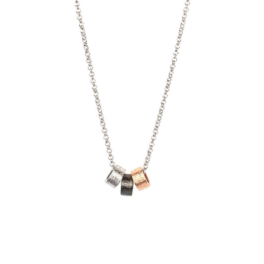 2. Studio image of MyaMoon's Airy Dots Choker in rhodium and rose gold plated 925 silver, showcasing minimalist design