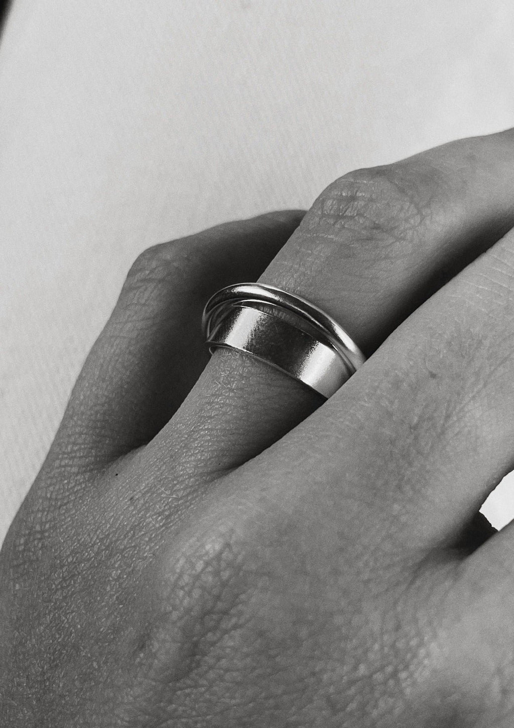 3. Close-up of NO MORE Andromeda Ring in sterling silver on a woman's hand, highlighting unique handcrafted design