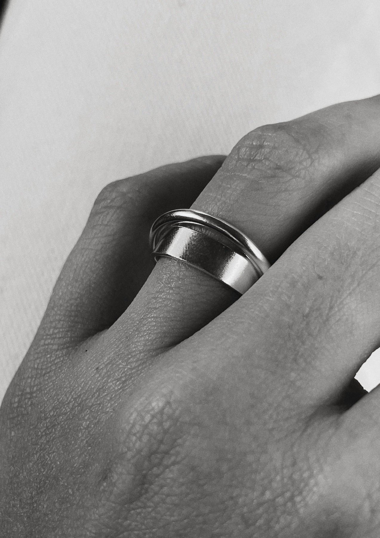 3. Close-up of NO MORE Andromeda Ring in sterling silver on a woman's hand, highlighting unique handcrafted design
