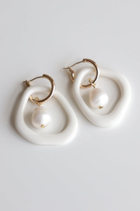 4. Studio shot of Rozenthal Arp Pearl and Porcelain Hoops in white with freshwater pearls and 18k gold-plated hoops