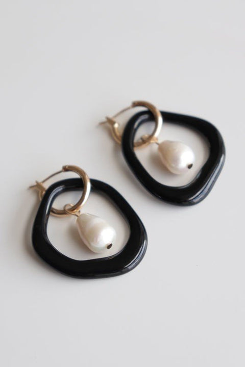 4. Rozenthal Arp Pearl and Porcelain Hoops in black with freshwater pearls and gold-plated hoops, studio shot