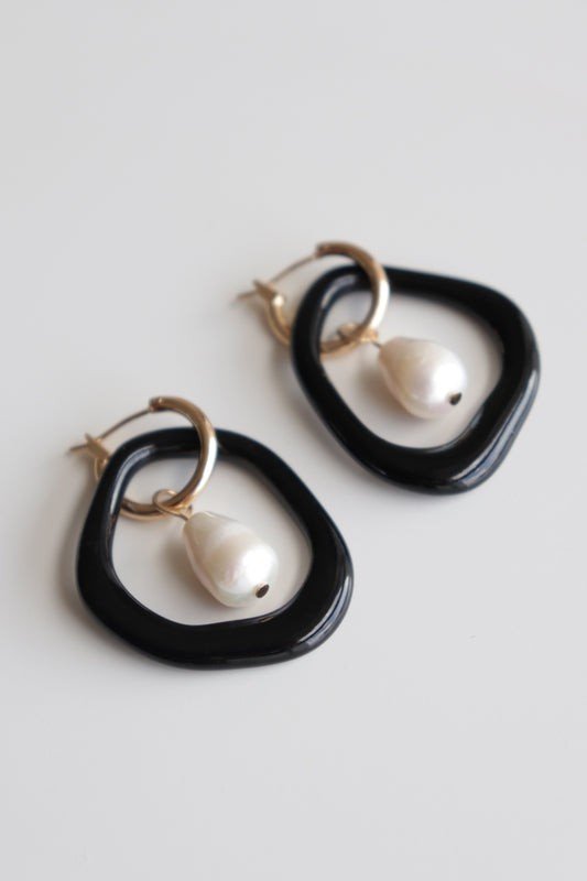 7. Studio image of Rozenthal Arp Pearl and Porcelain Hoops in black with freshwater pearls and gold-plated hoops
