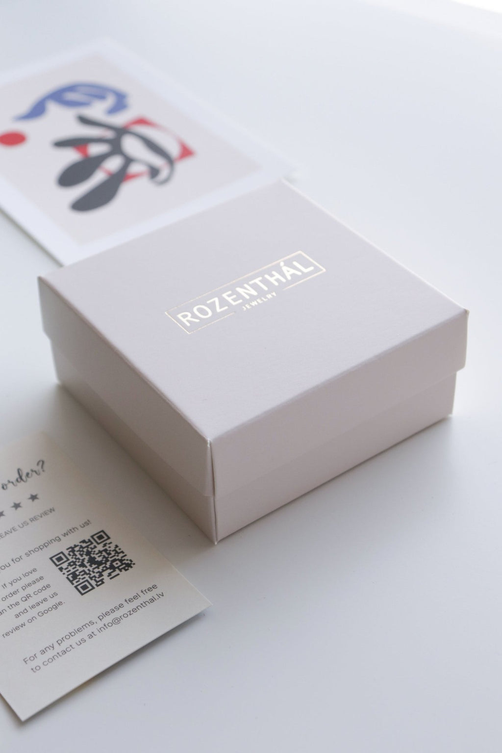 11. Rozenthal branded packaging with product information and QR code