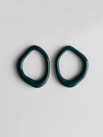 5. Flat lay of green porcelain hoops from Rozenthal Arp collection