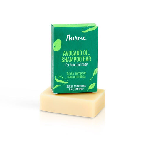 2. Nurme avocado oil shampoo bar in green packaging on top of beige soap bar against white background