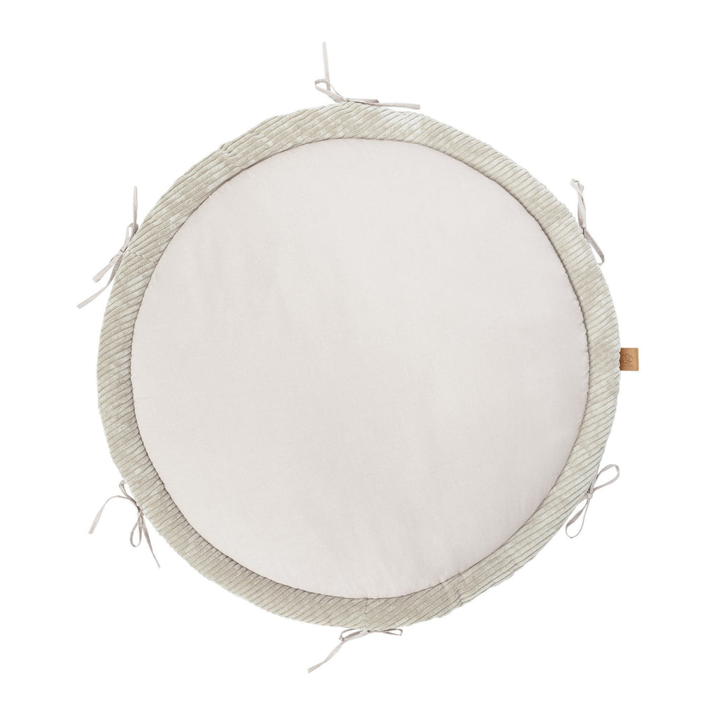 3. Ecru baby play mat with smooth center and ribbed border, featuring tie strings, shown from top view