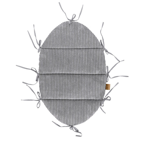 2. Studio shot of grey corduroy baby mat with fabric ties, designed for use with braided bumper