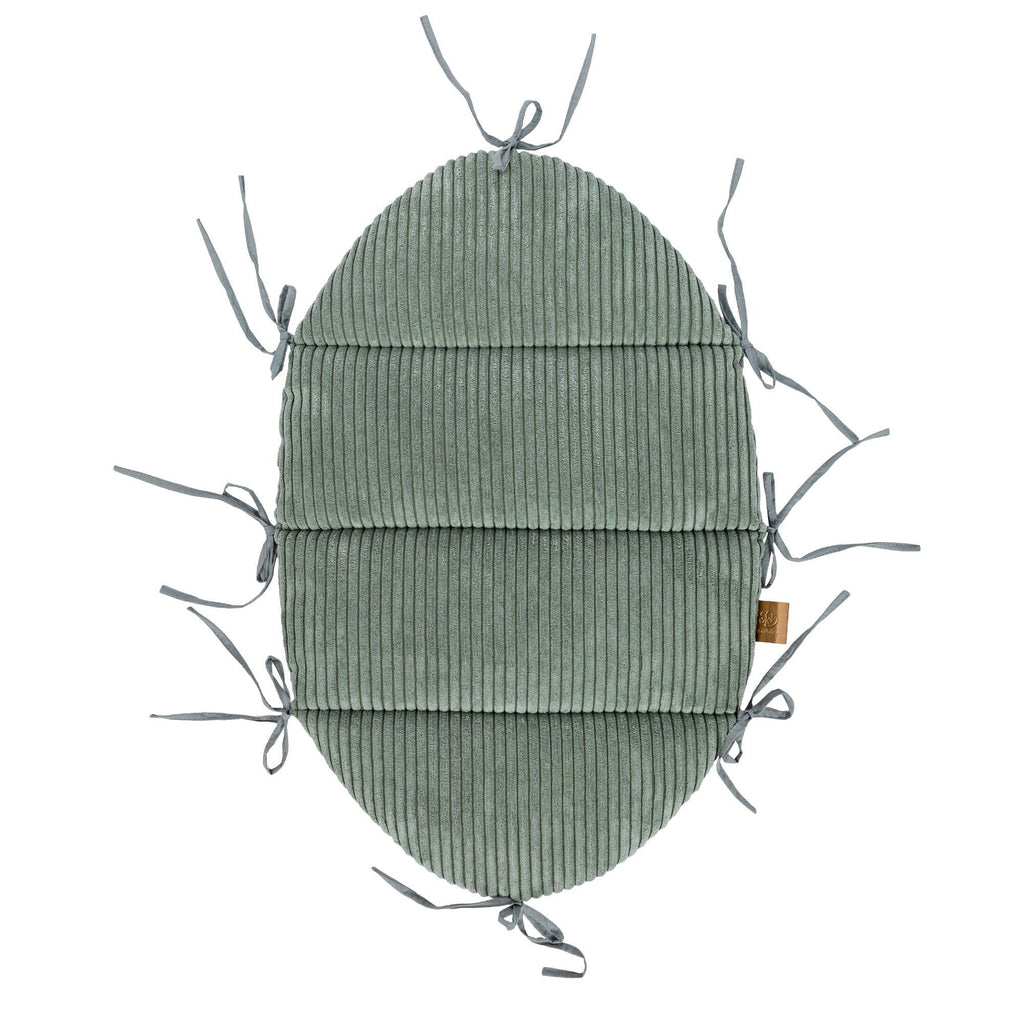 3. Flat lay of olive green baby nest mat with fabric ties, crafted from ribbed corduroy