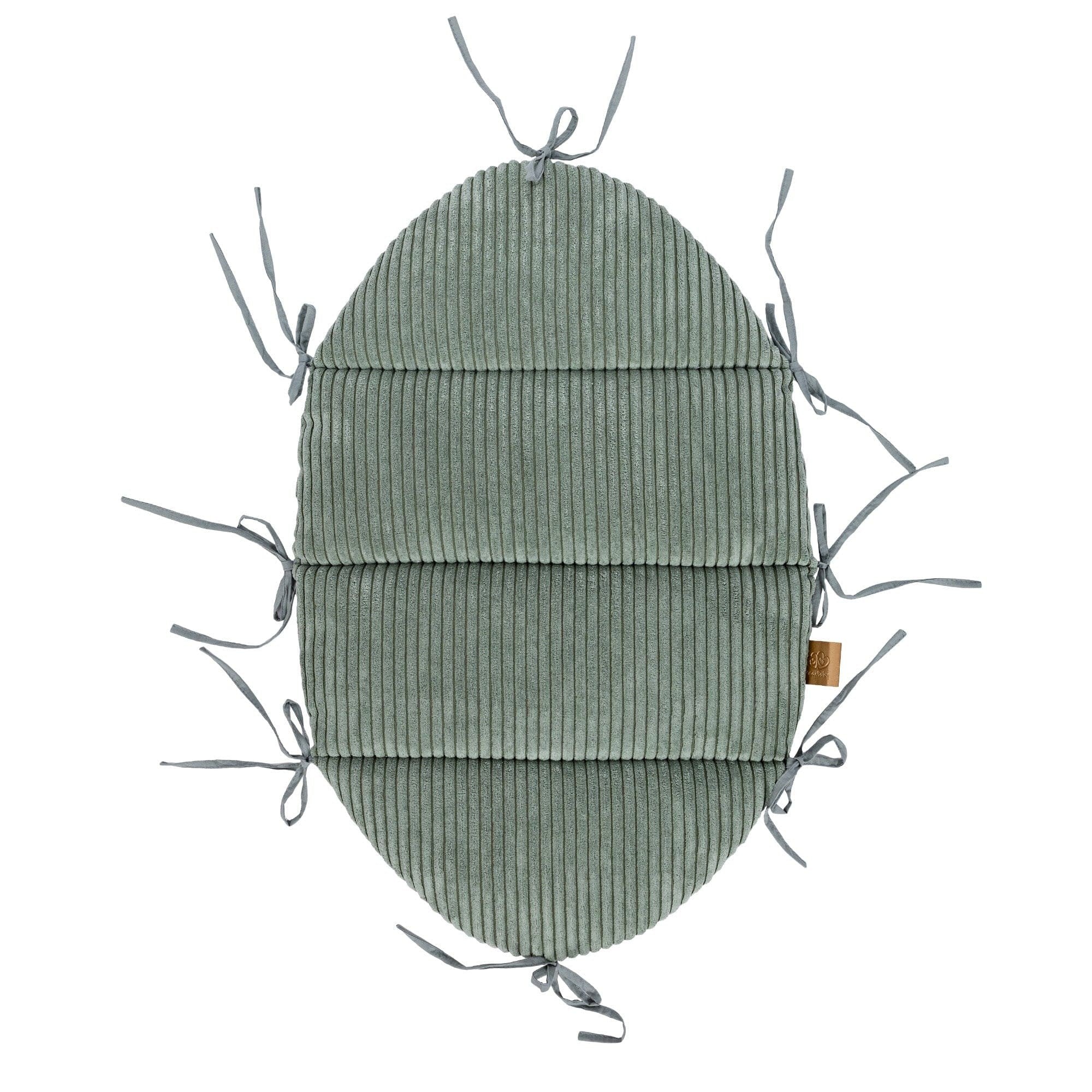 3. Flat lay of olive green baby nest mat with fabric ties, crafted from ribbed corduroy