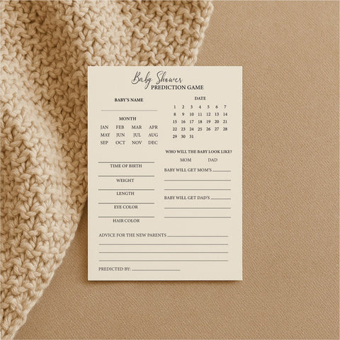 2. Single Beebila baby shower prediction game card on beige knitted fabric, with sections for baby's name, birth details, and advice, printed on thick cream Munken Pure paper.