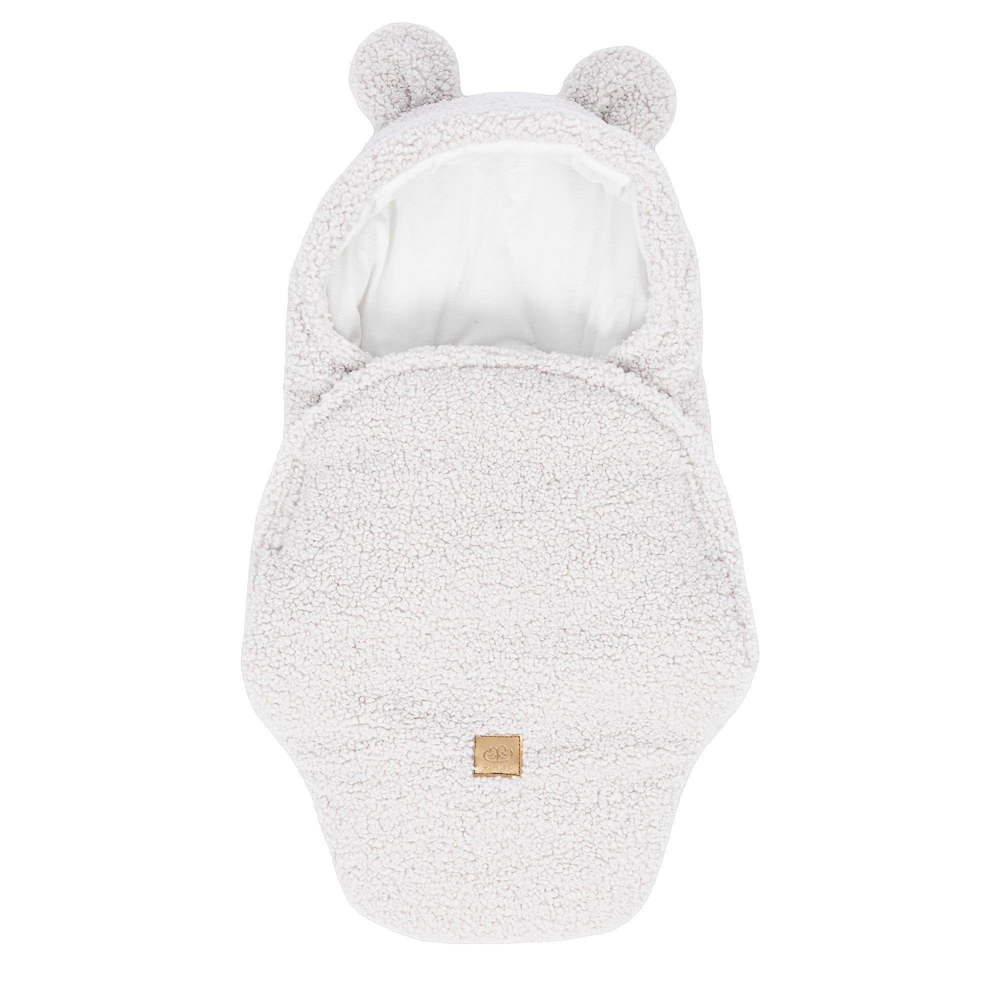 1. Off-white baby swaddle with bear ears made of boucle fabric, featuring a cotton inner layer and velcro closure, shown in a flat lay view