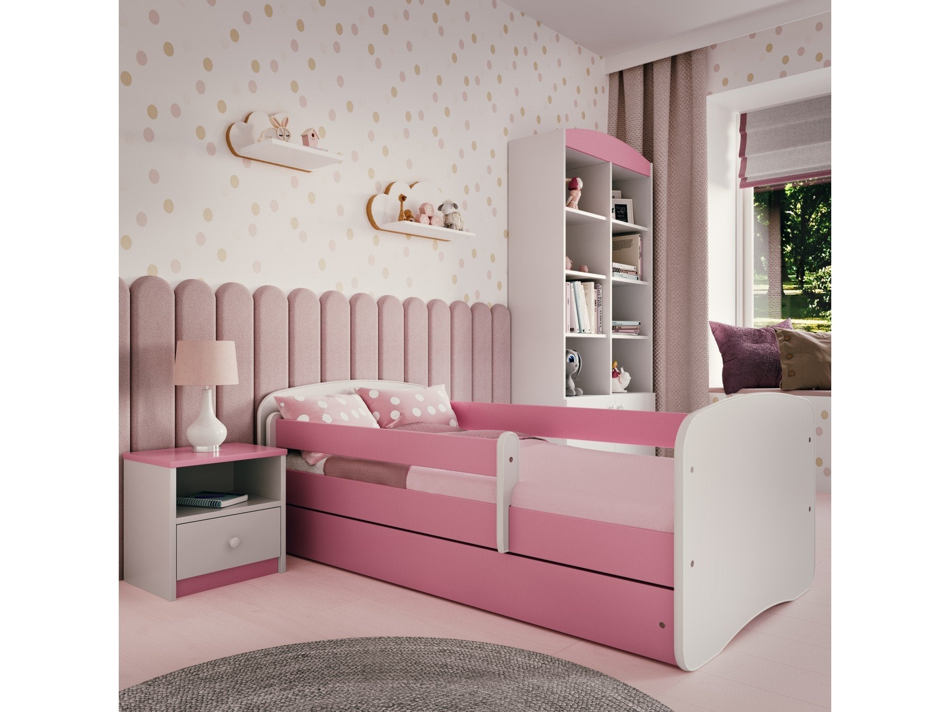 2. Pink and white bedside table next to matching children's bed in a pastel-themed bedroom