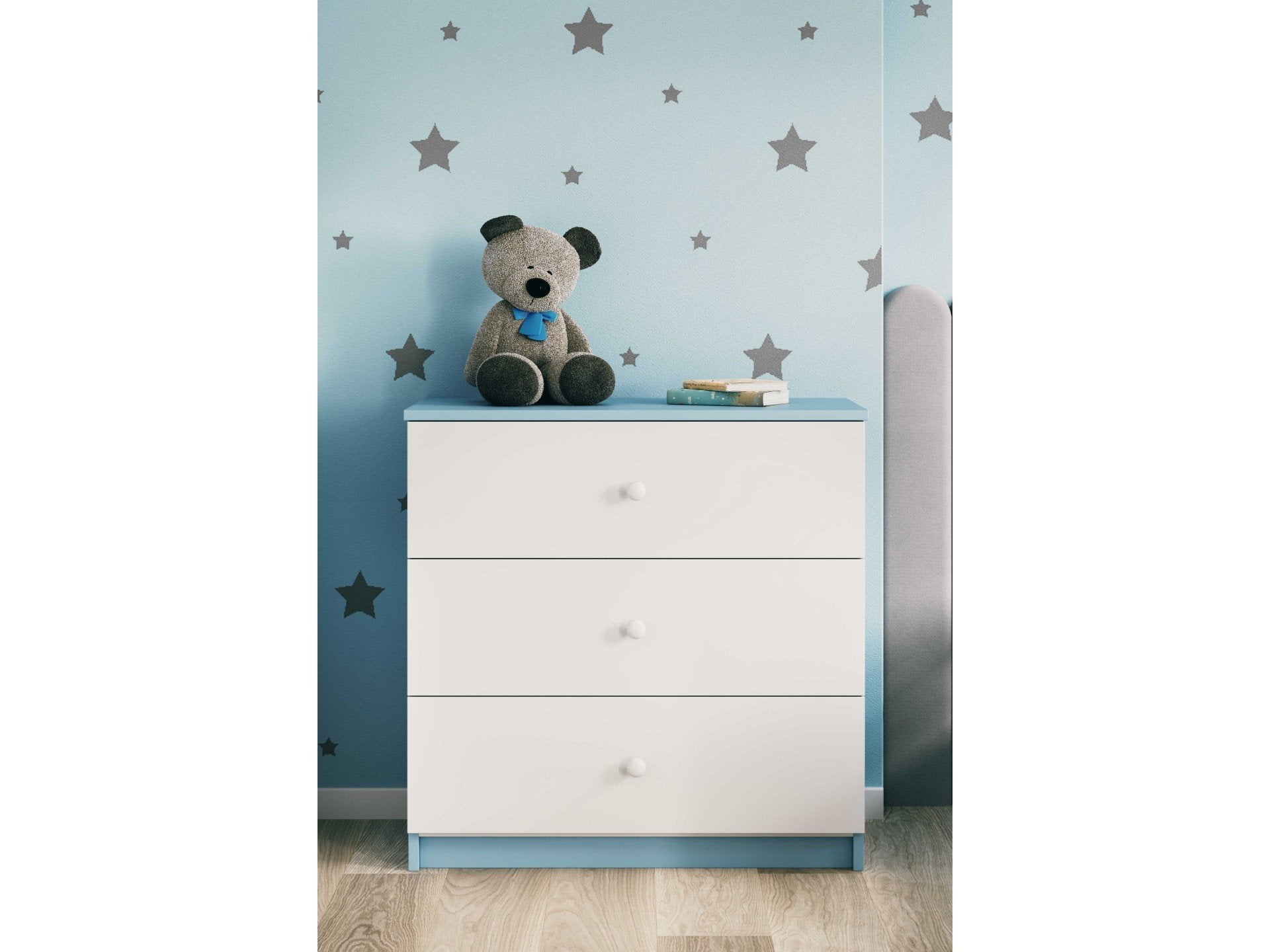 9. Babydreams chest of drawers with blue accents in a child's room with star wallpaper