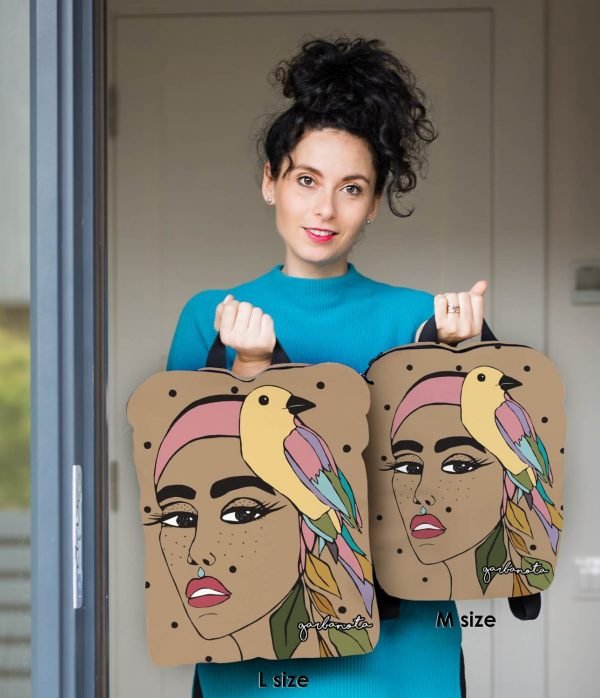 3. Woman holding Garbanota BACKPACK TINA in L and M sizes, featuring colorful artwork and bird design