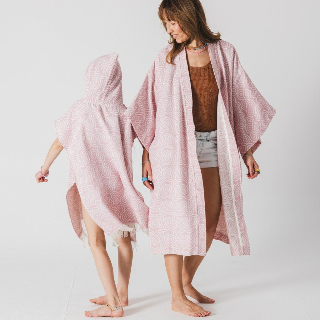 8. Woman and child wearing matching Patulove rose bamboo bath ponchos, standing and smiling