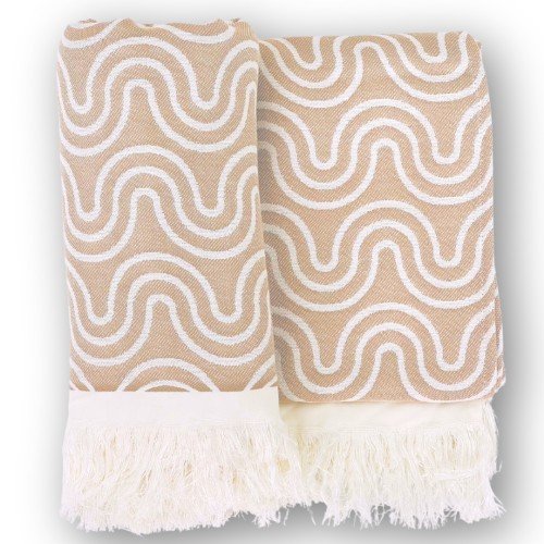 6. Flat lay of two sand-colored bamboo bath ponchos with wave pattern and fringe detail