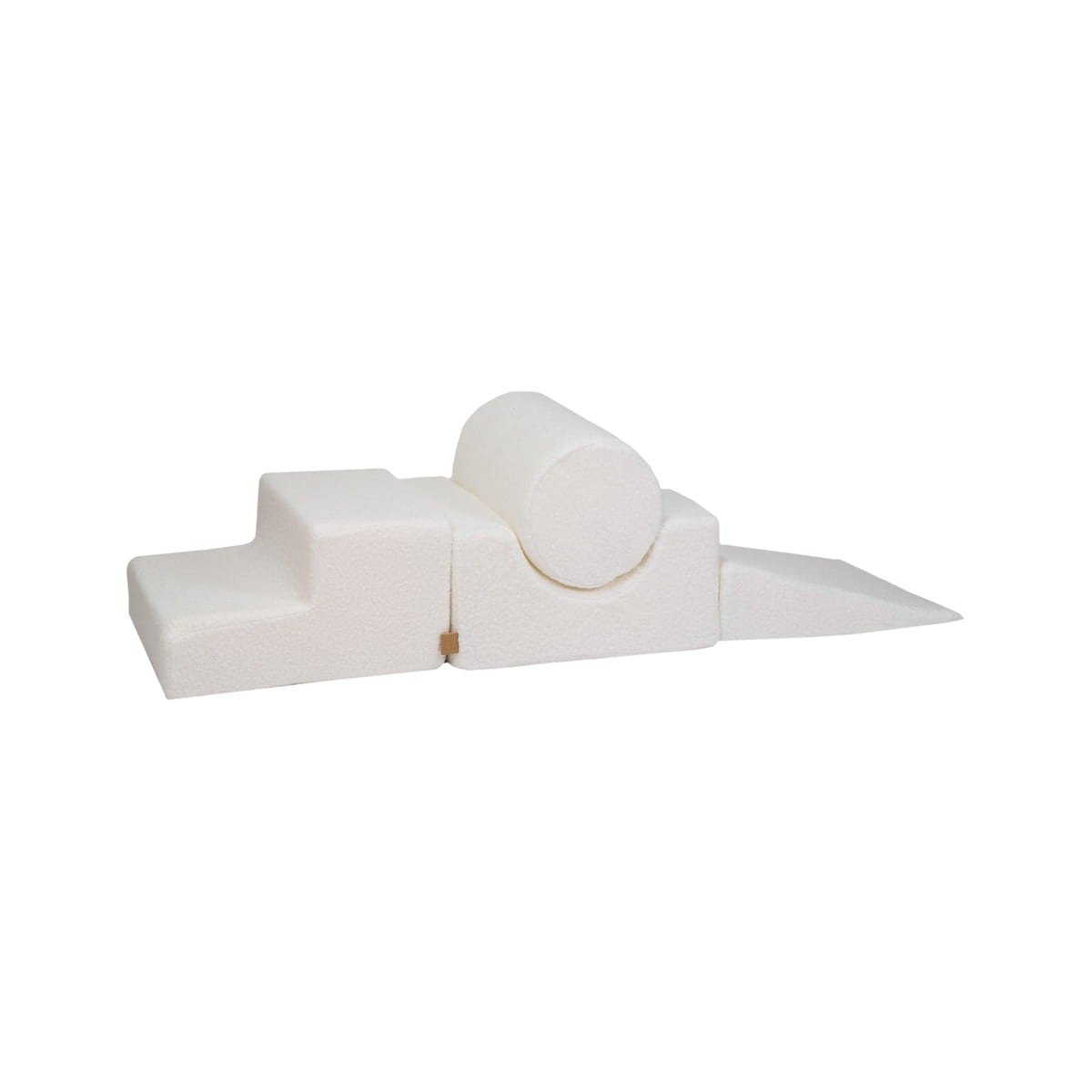 2. Cream corduroy children's playset with four geometric shapes including a cylinder, step, and wedge on a white background