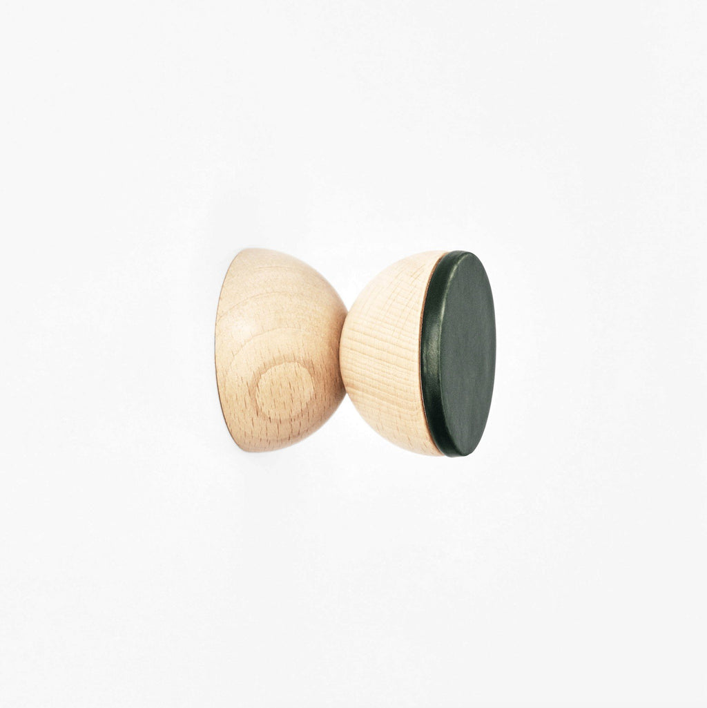 2. Close-up of Beech Wood & Ceramic Wall Hook in dark green by 5mm Paper, showing geometric design