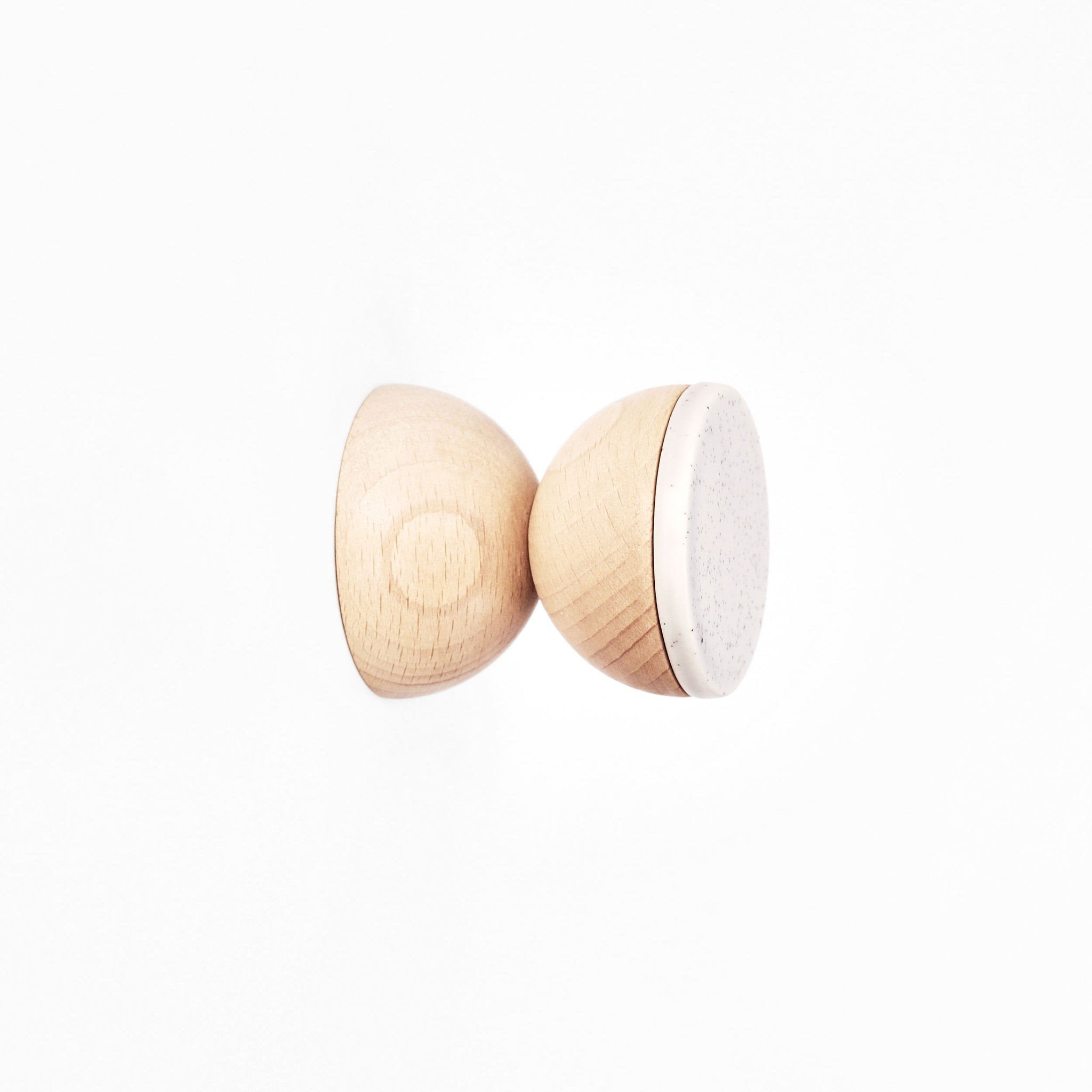 4. Close-up of 5mm Paper Beech Wood & Ceramic Wall Hook in grey sand, highlighting material and design