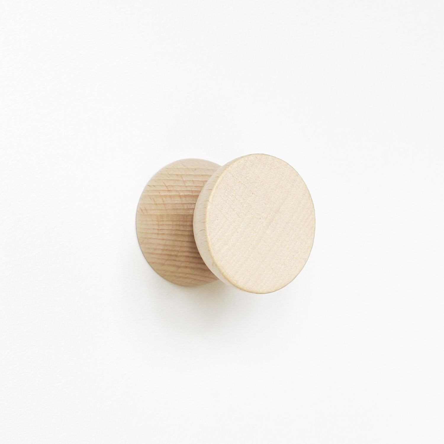 6. Close-up of a single beech wood wall hook by 5mm Paper showing wood grain and finish