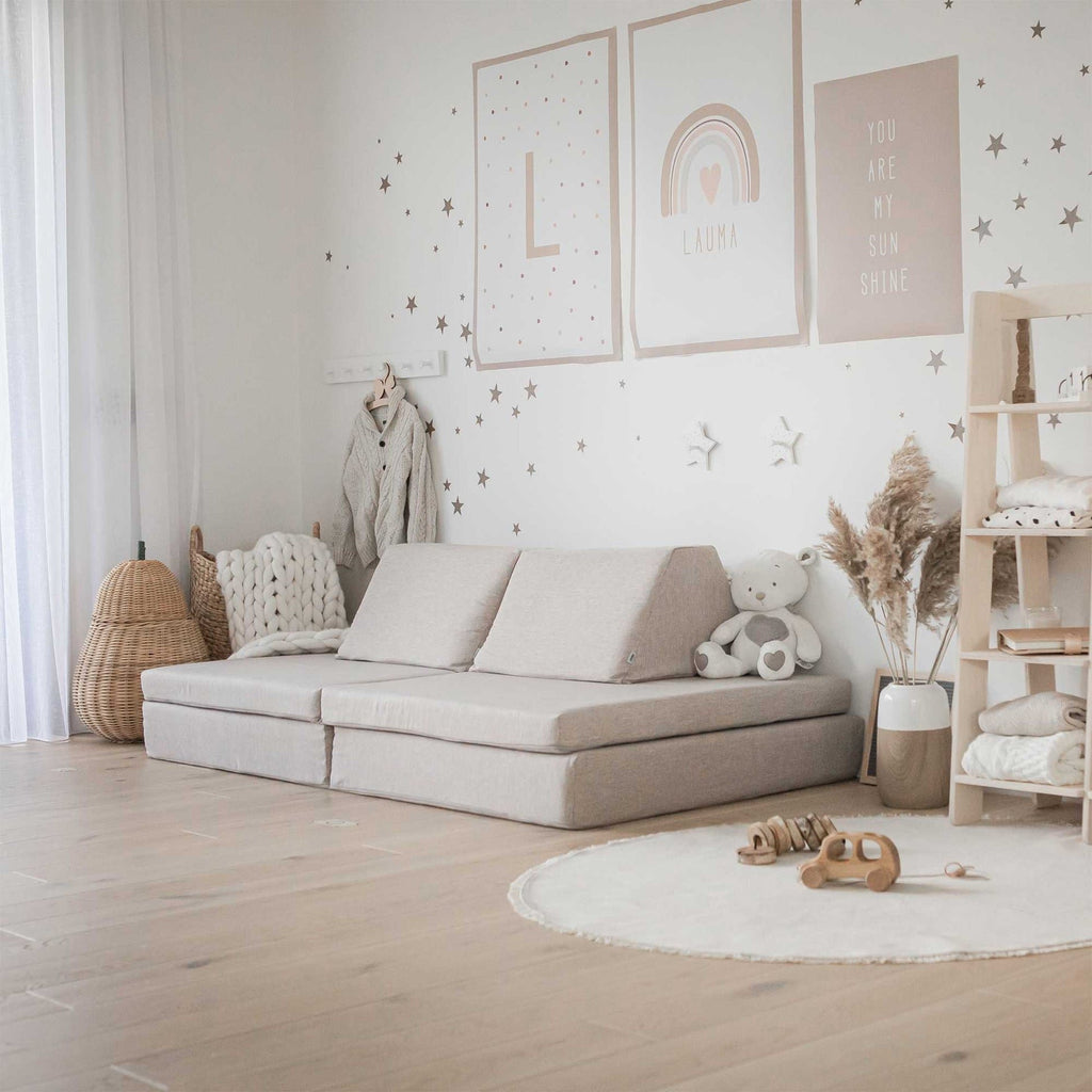 11. Beige Monboxy play mattress set arranged as a sofa in a stylish children's room