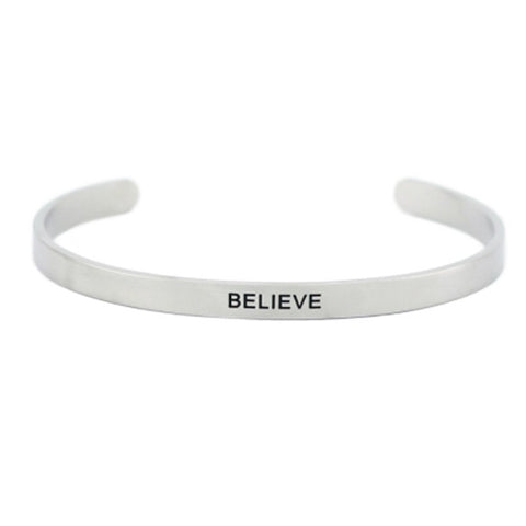 1. Men's Olla 'Believe' bracelet in polished stainless steel with deep-engraved inspirational message, shown in studio setting