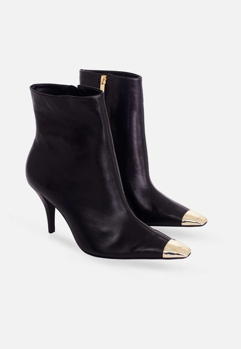 2. Pair of black calf leather ankle boots with gold pointed toes and side zips, angled view on white background