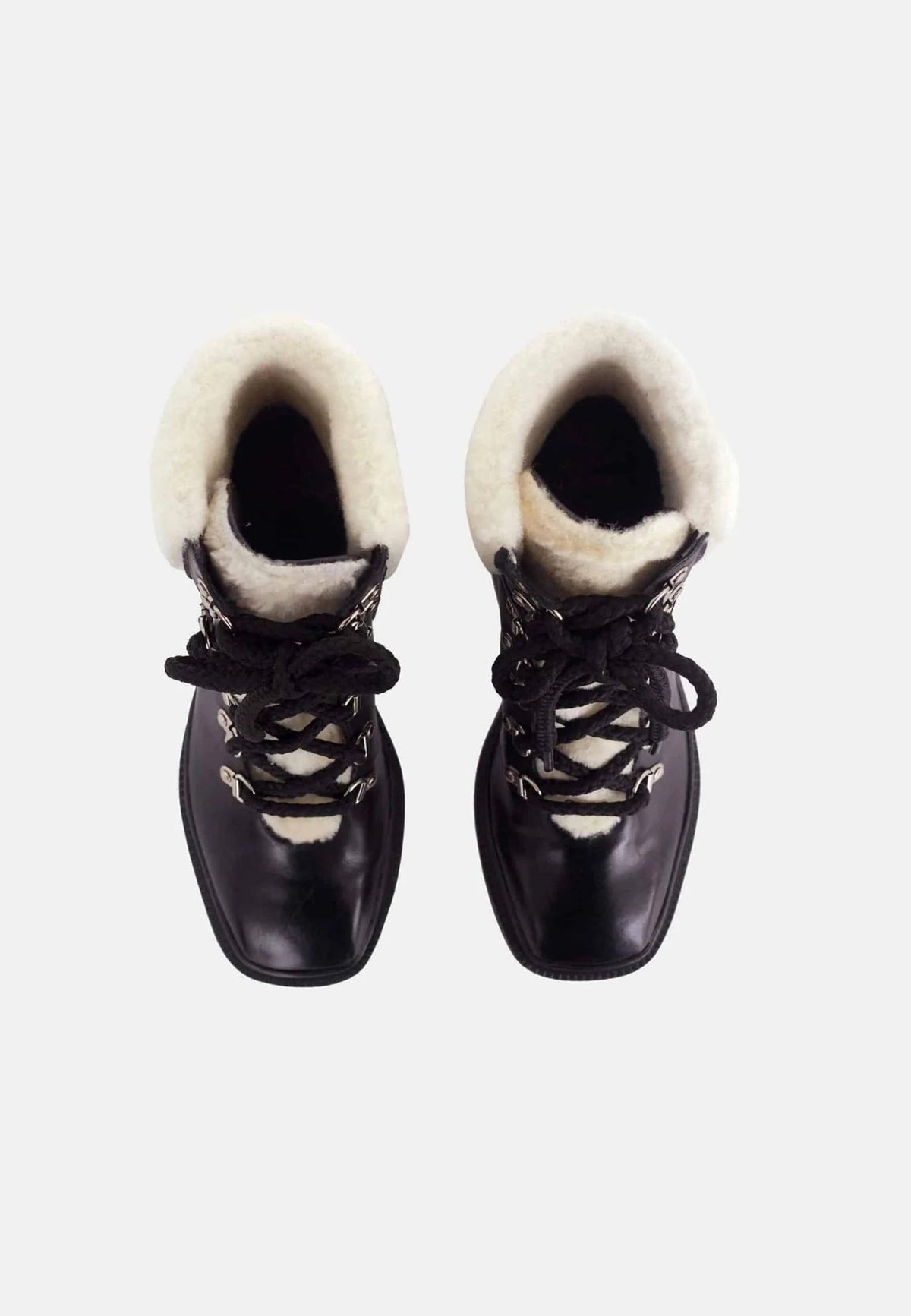 3. Top view of black calf leather combat boots with shearling lining and lace-up closure on white background