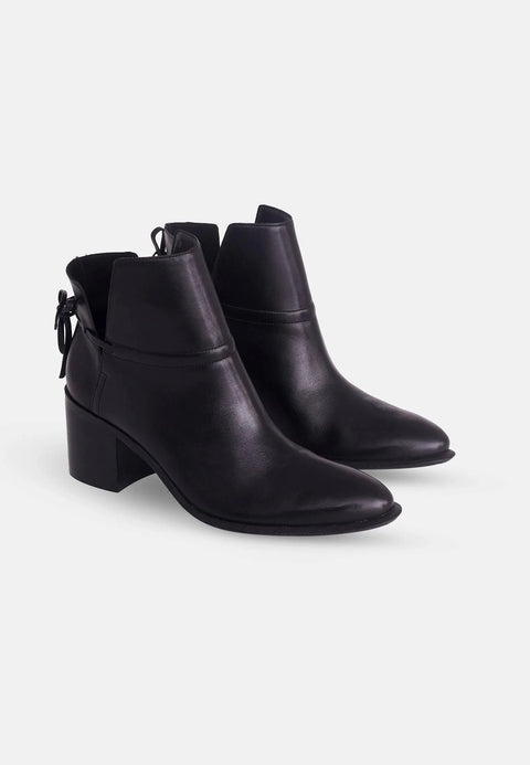 2. Pair of women's black leather ankle boots with block heel shown in three-quarter view on white background