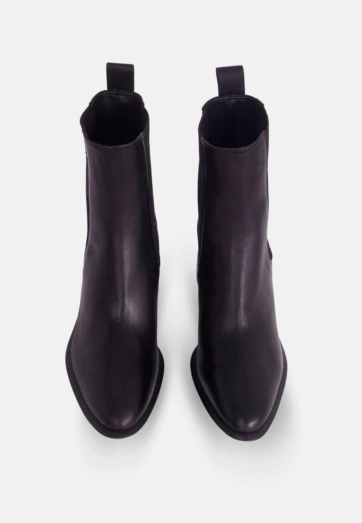 2. Top view of black leather Chelsea ankle boots showing rounded toe and pull tab