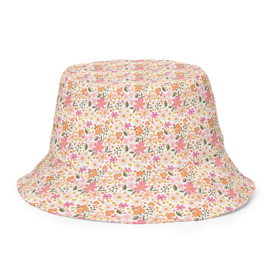 1. Blushing Blossom reversible bucket hat with pink and orange floral pattern on beige background
