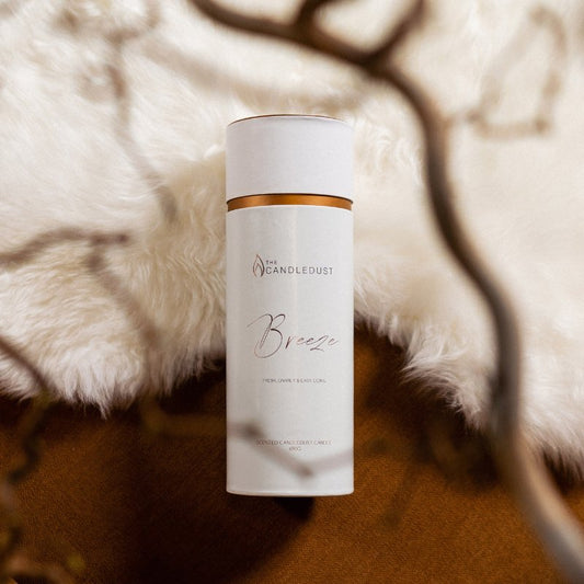 1. Candledust Powder Candle - Breeze packaging in a cozy setting with soft textures