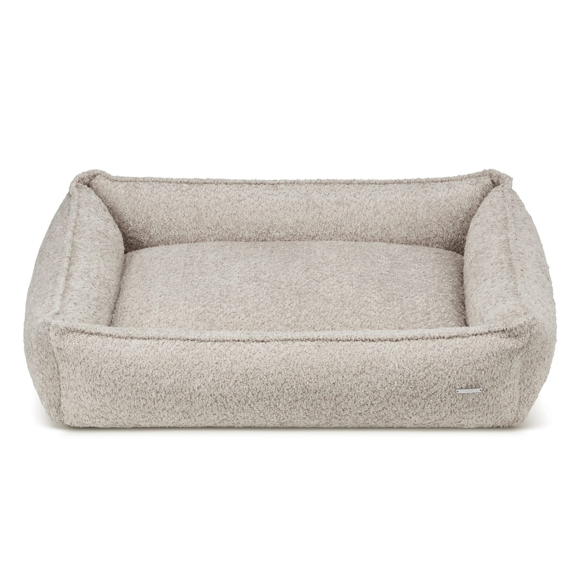 2. Light beige boucle dog bed by Labbvenn with high sides for stability, shown in studio setting highlighting texture and design