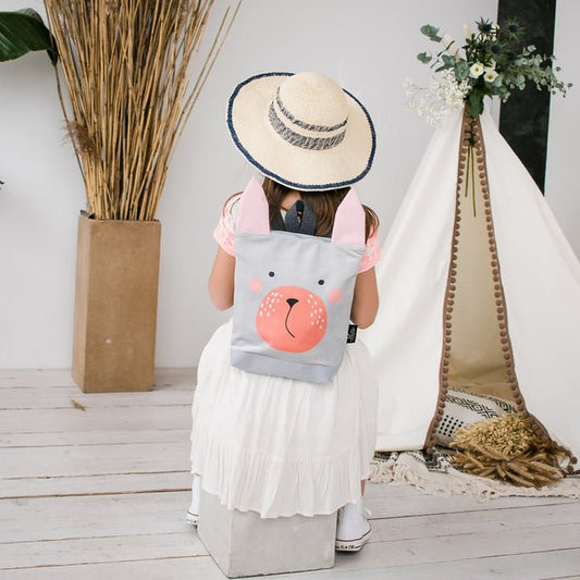2. Girl wearing Muni Bunny kids backpack in lifestyle setting, highlighting comfort and style