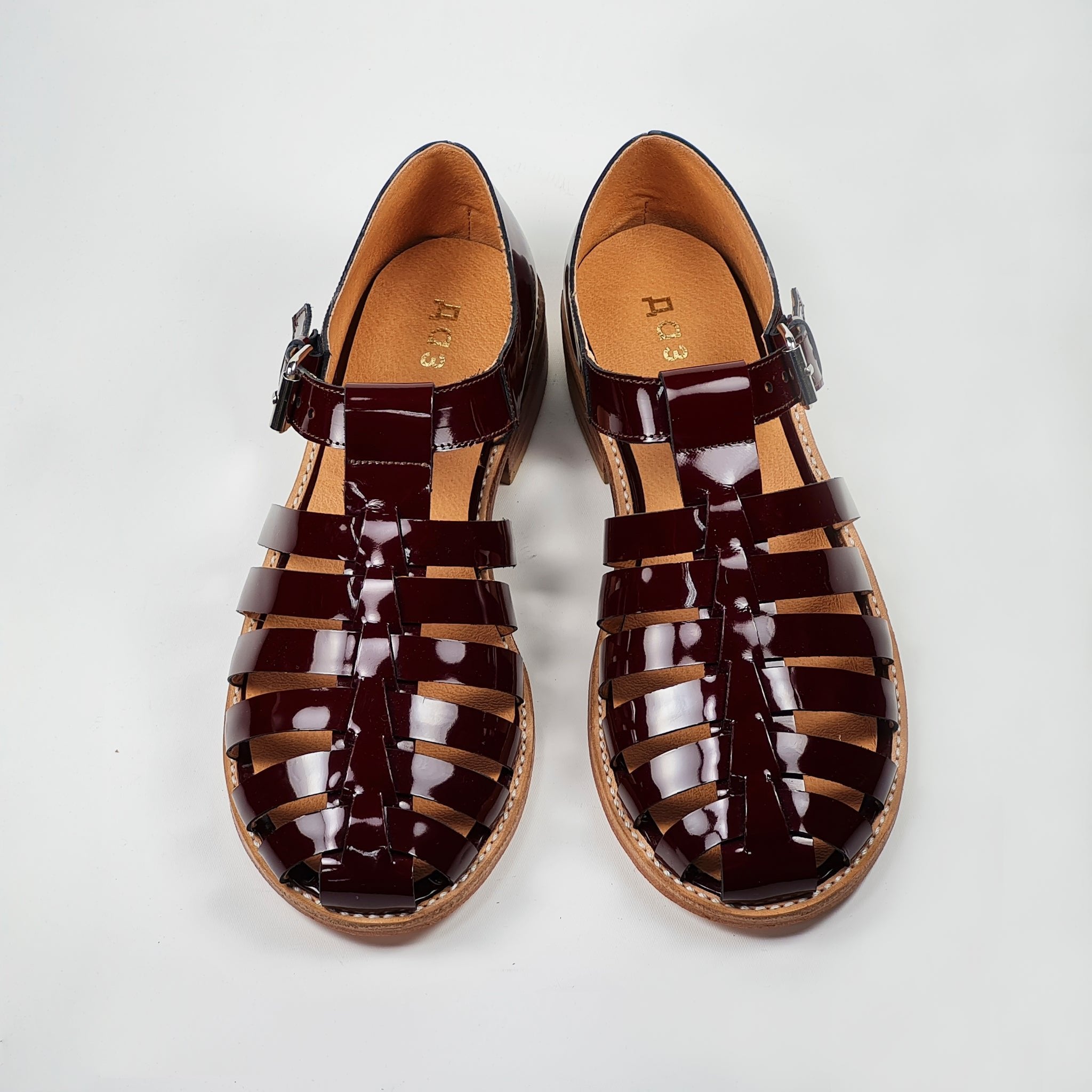 5. Handmade burgundy leather fisherman sandals by Daz Studio, top view in studio