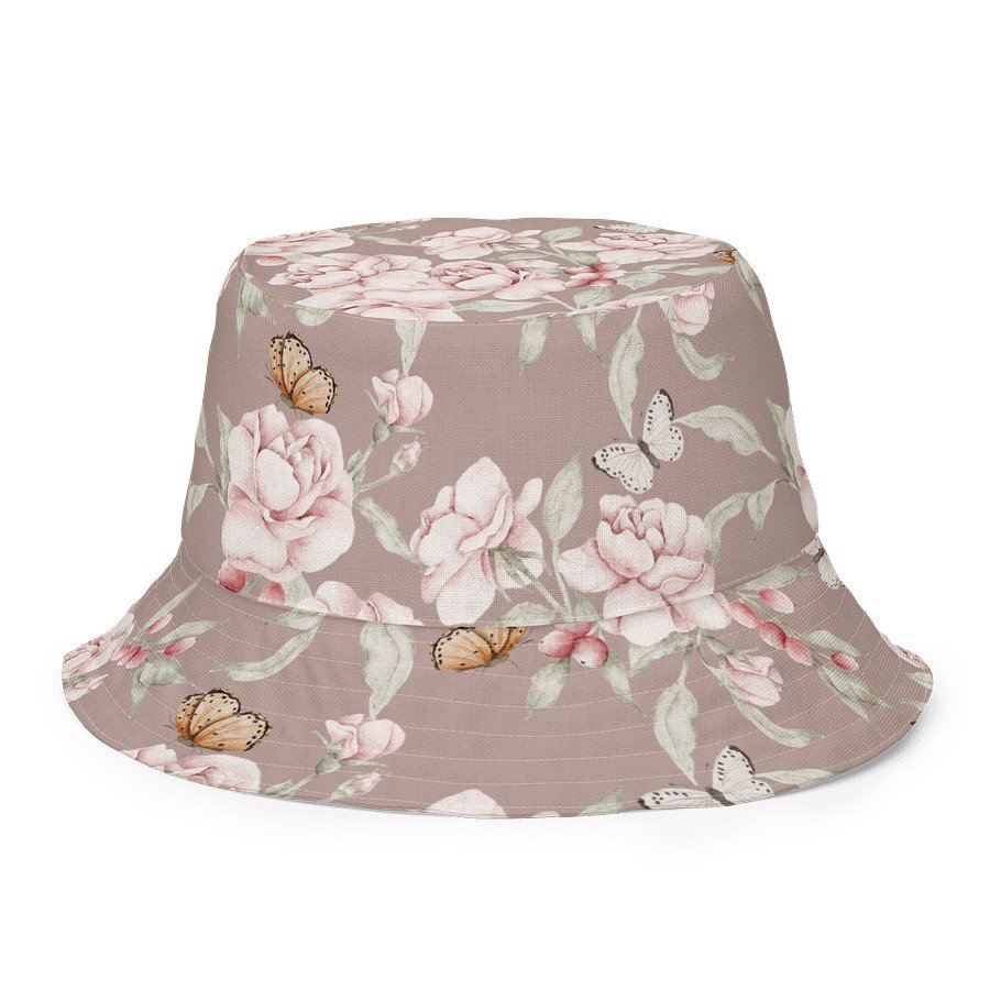 2. Butterfly Blooms reversible bucket hat with floral and butterfly pattern on green background, showcasing breathable polyester material