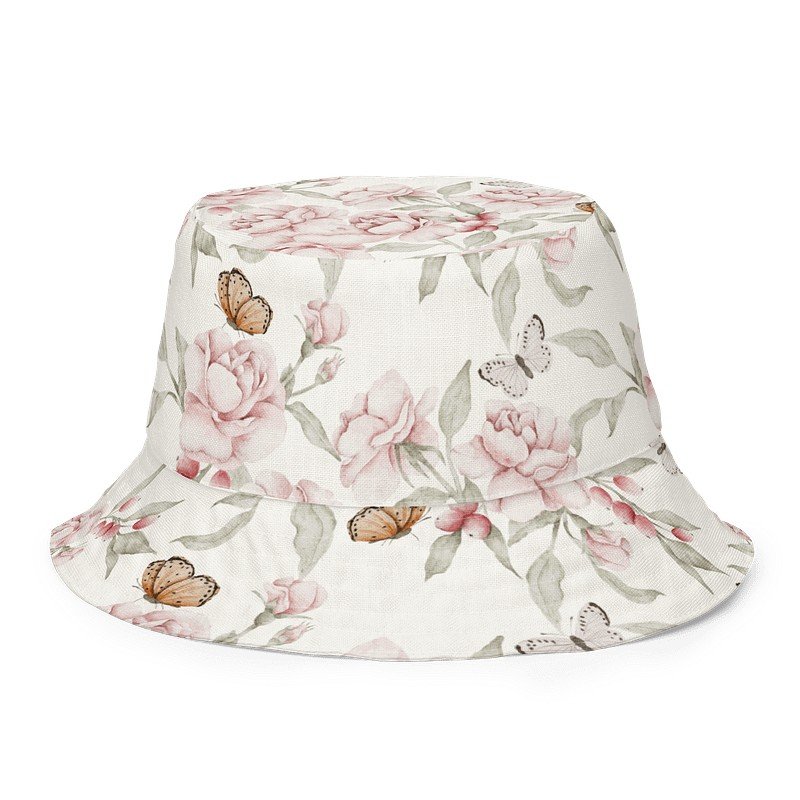 7. Butterfly Blooms reversible bucket hat with floral and butterfly pattern on beige background, highlighting breathable fabric