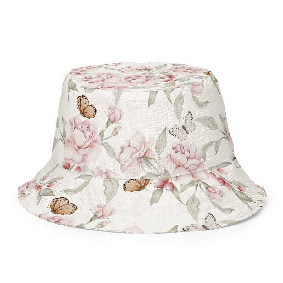 1. Butterfly Blooms reversible bucket hat with floral and butterfly pattern on beige background, made from linen-feel polyester fabric