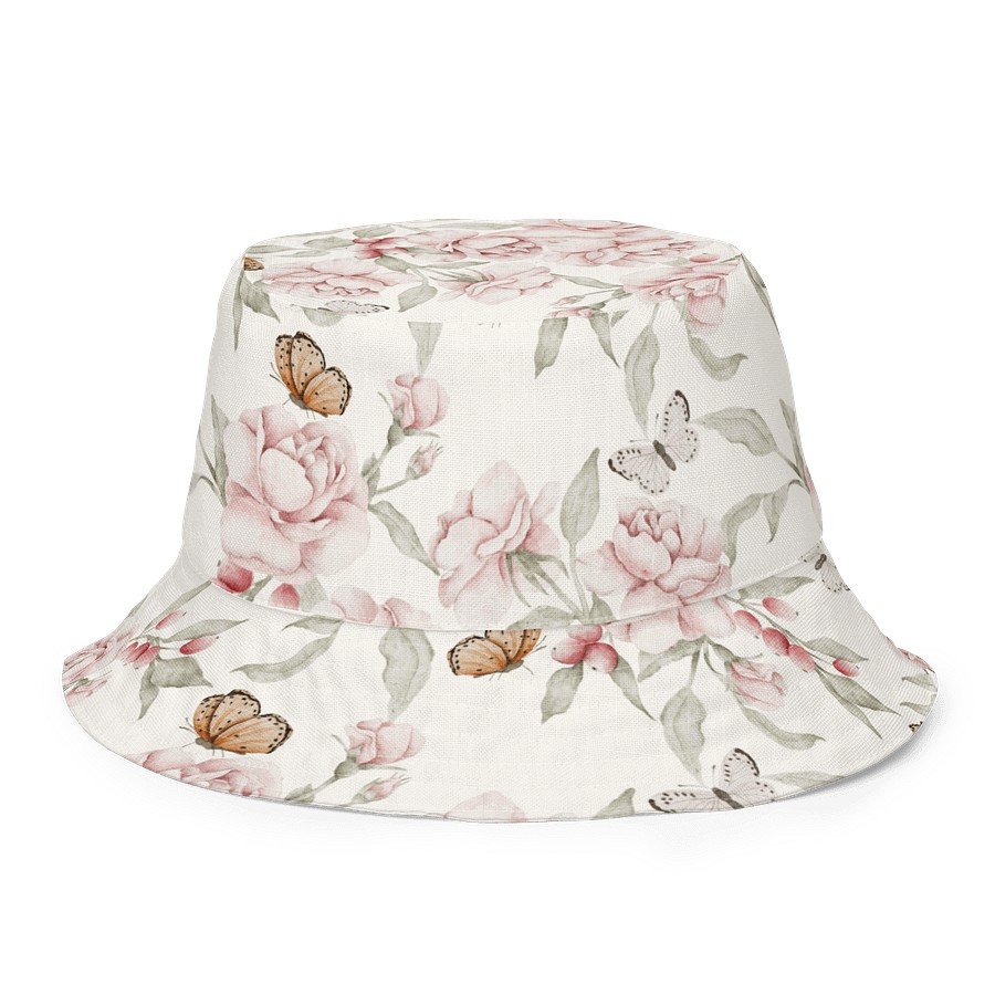 8. Butterfly Blooms reversible bucket hat with floral and butterfly design on beige background, made from moisture-wicking polyester