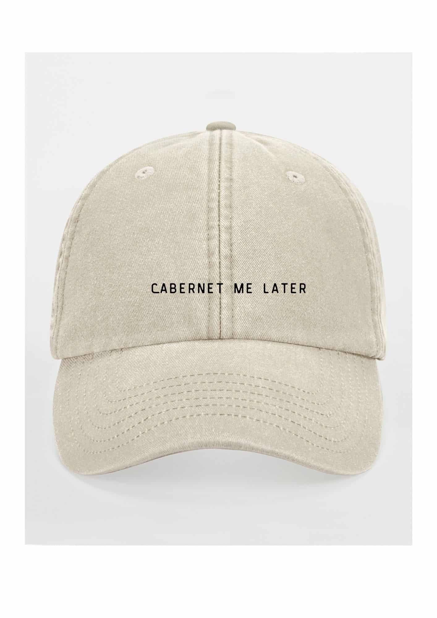 2. Beige cap with 'Cabernet Me Later' text on clean white background