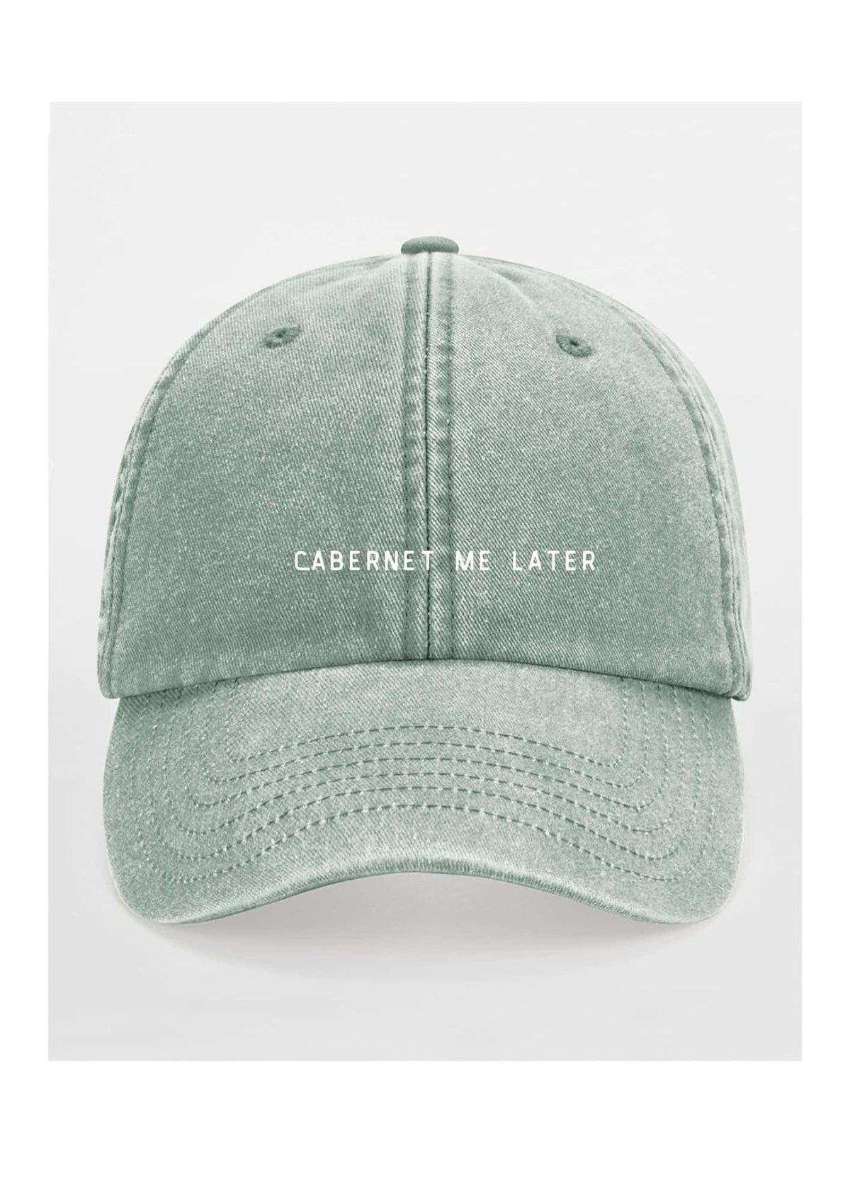 4. Sage green cap with 'Cabernet Me Later' text on clean white background
